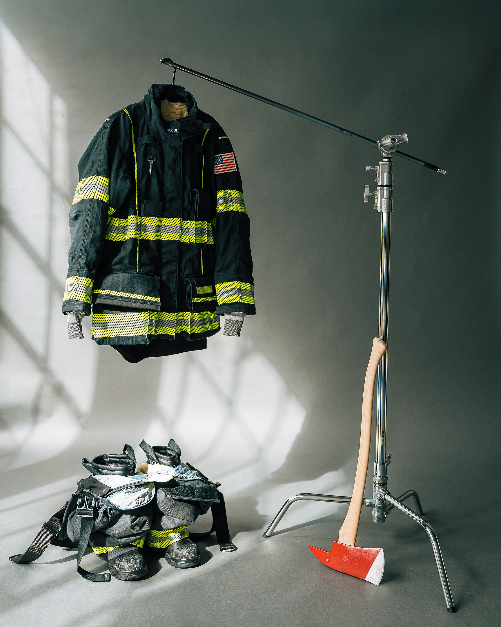 Turnout gear and an axe staged in the studio for a product shoot